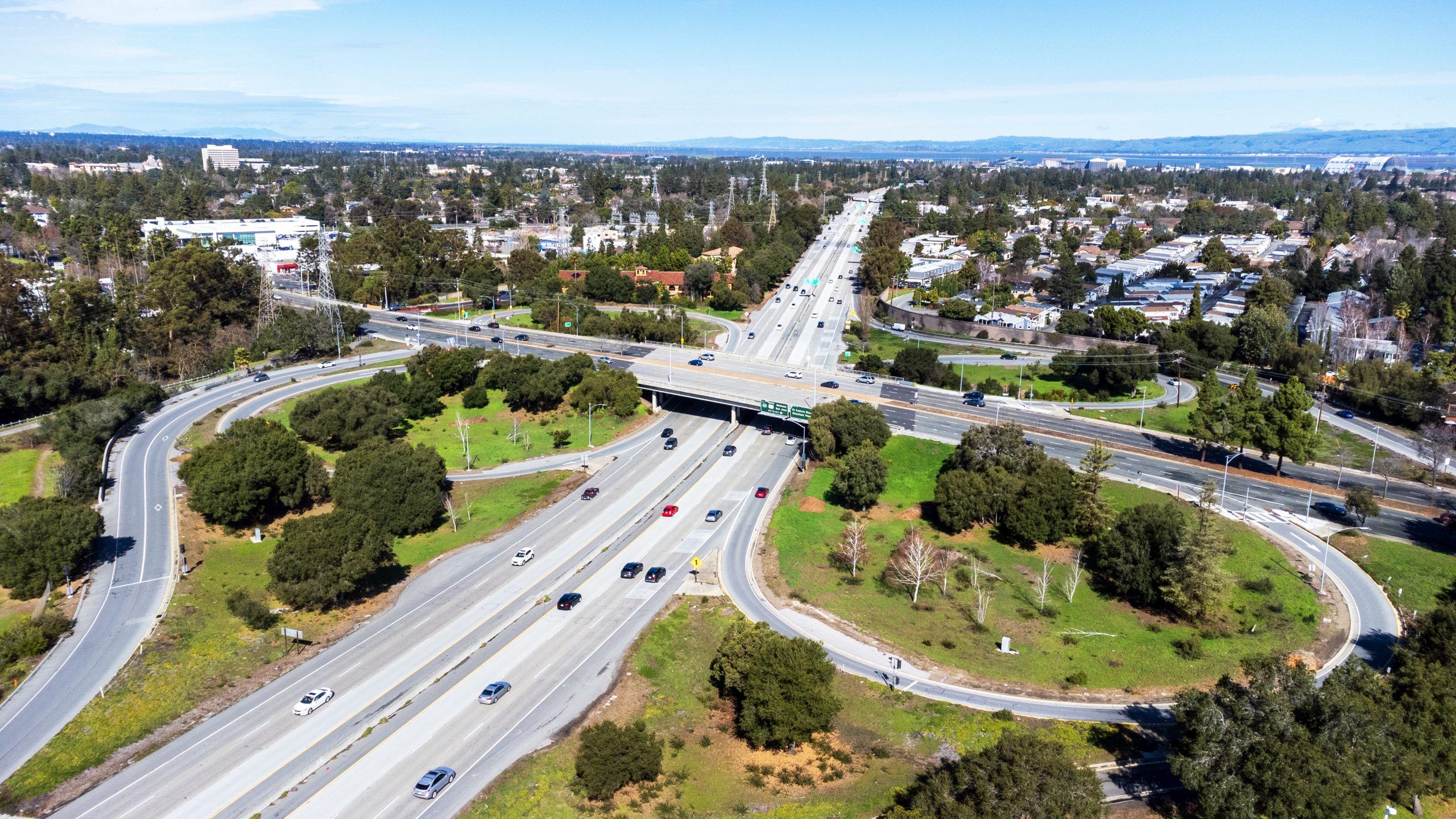 Aerial view of a light weekend traffic on Highway 85 and El Camino Real junction in Mountain View, California. Looking toward San Francisco Bay